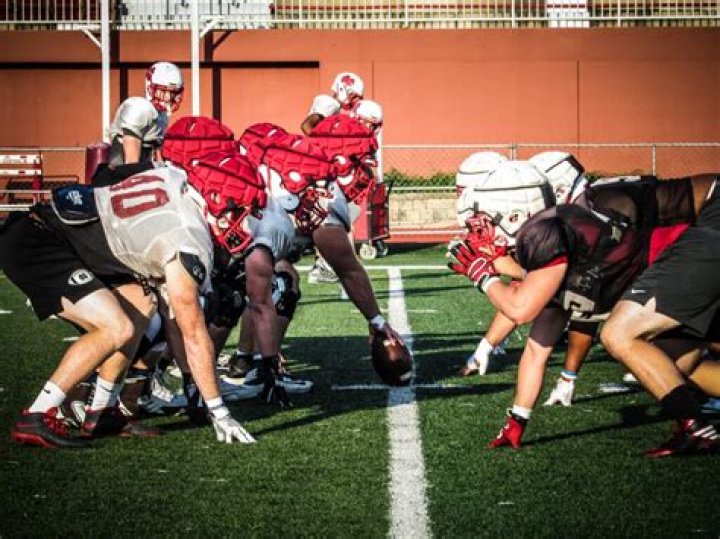 Can a football player play both offense and defense?