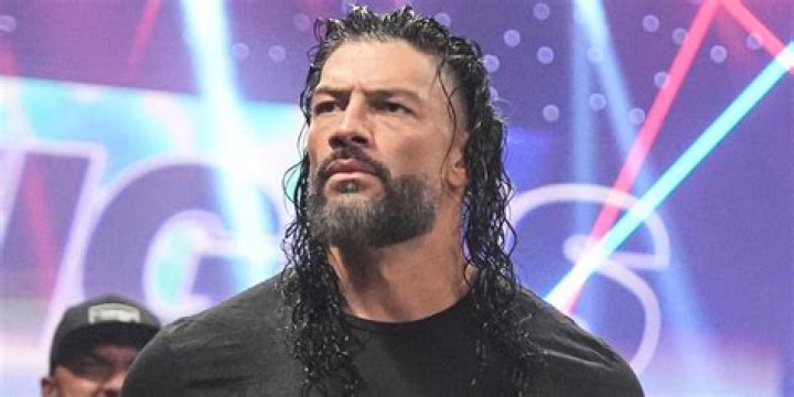 Did Roman Reigns win both titles at WrestleMania 38?