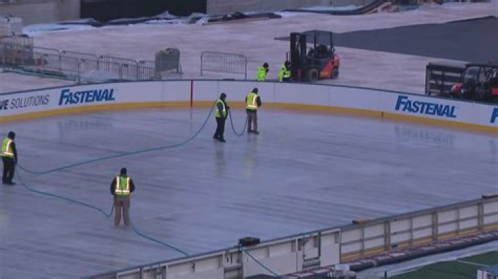 How deep is the ice on a hockey rink?