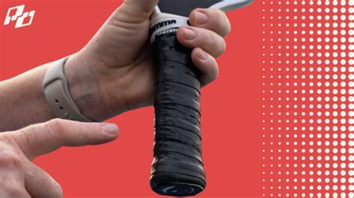 How do you clean a pickleball paddle grip?