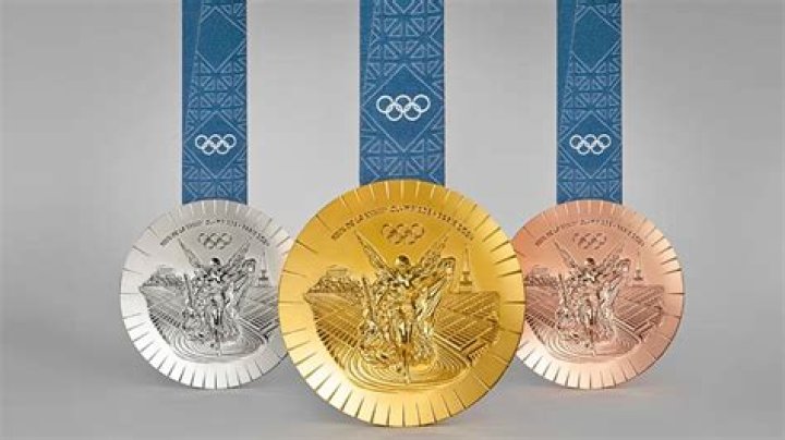 How old is the oldest person to win an Olympic gold medal?