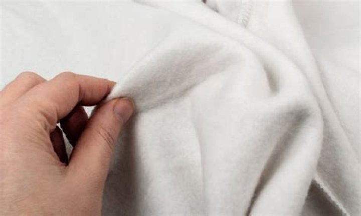 Is polyester warmer than wool?