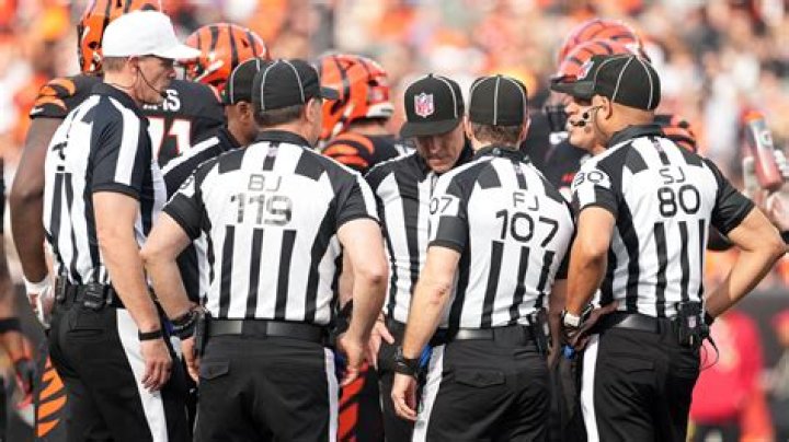 What are the black things on NFL referees hands?