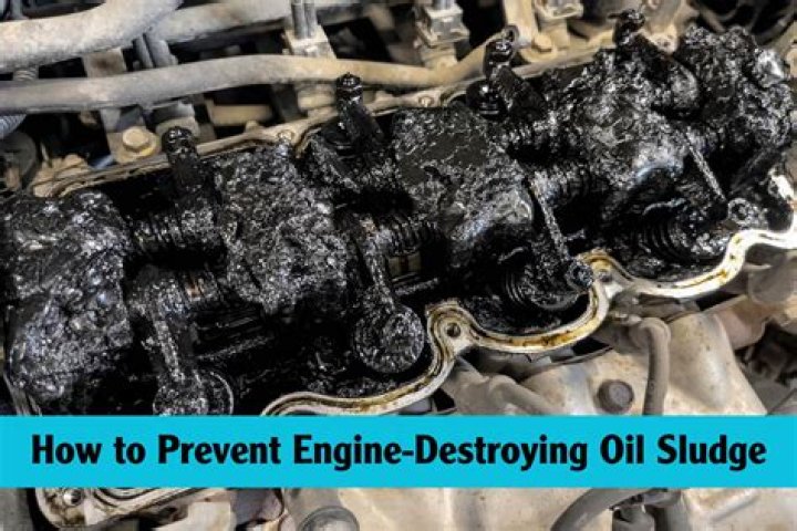 What causes oil sludge?