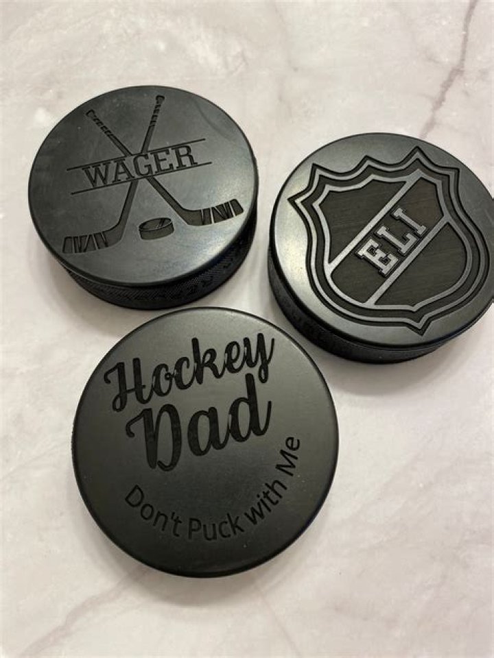 What was the first ice hockey puck?