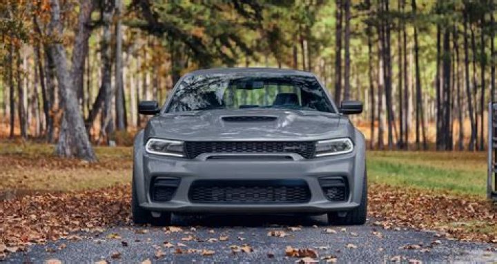 Which car is faster Tesla or Hellcat?