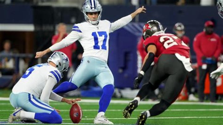 Who holds the ball for the kicker?