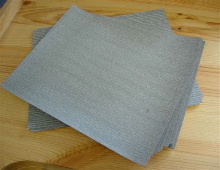 Who invented sandpaper?