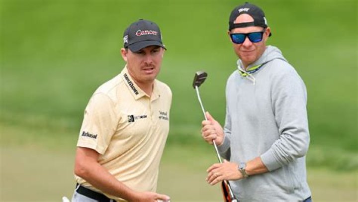 Who is John Wood caddying for?