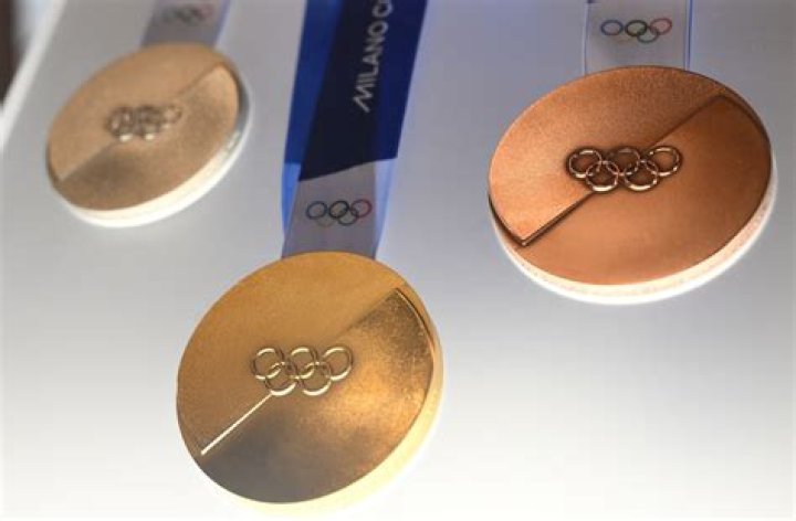 Who is the oldest person to receive a medal in the Winter Olympics?