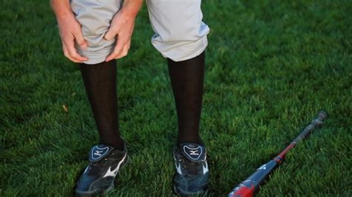 Why do baseball players tuck their pants into their socks?