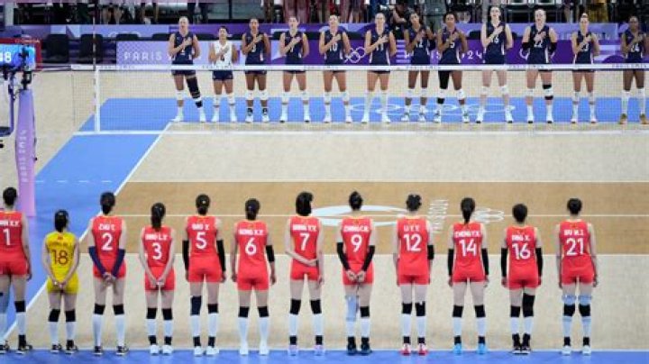 Why do volleyball players hold up numbers?